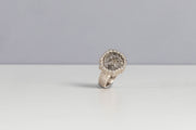 Todd Reed ring with a natural rough diamond (16.60ctw) and white brilliant cut diamonds (0.57ctw), hand fabricated in palladium.